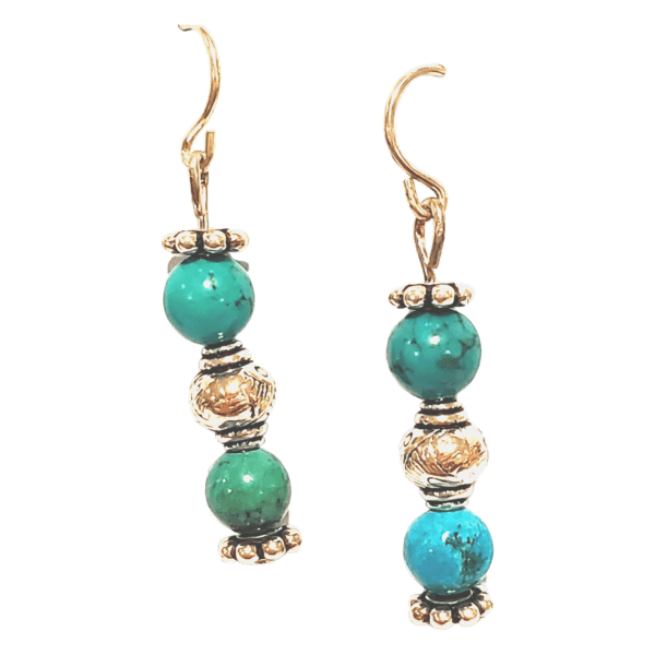 The Blue Bells are gold earrings featuring two turquoise beads and intricate gold spherical accents on hooks.
